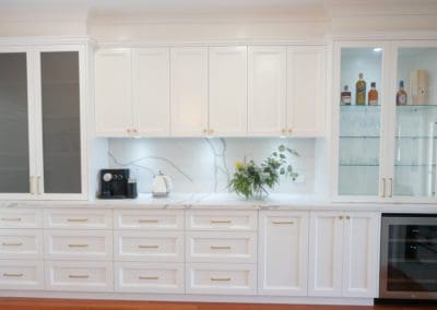 Elegant refined two toned kitchen Harrington Park white cabinetry appliance cabinetry