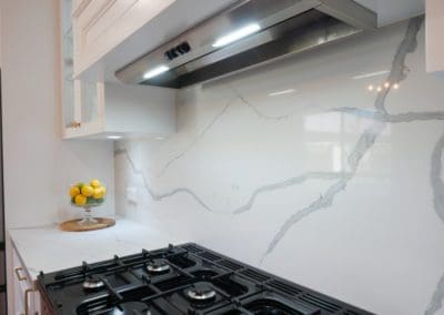 Elegant refined two toned kitchen Harrington Park stone splashback