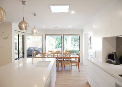 Stylish-mirrored-modern-kitchen-Burradoo-cabinetry-lighting