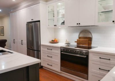 two toned luxury hamptons kitchen elderslie cooktop run white cabinetry