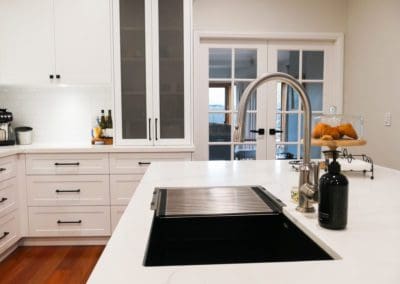 two toned luxury hamptons kitchen elderslie island stone silver tap ware