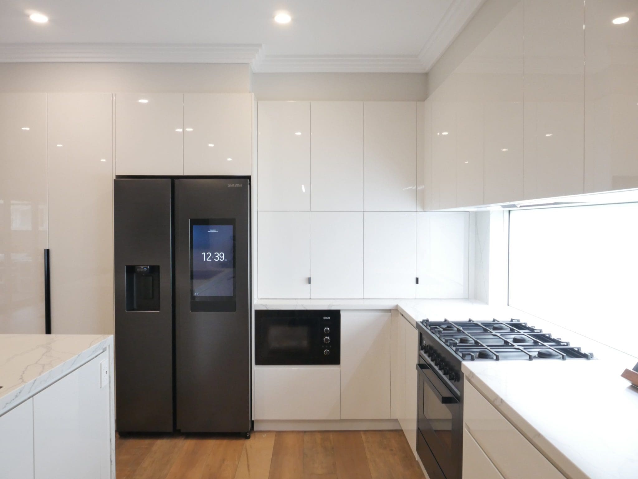 streamlined sophisticated kitchen mount annan white laminate cabinetry and grey fridge
