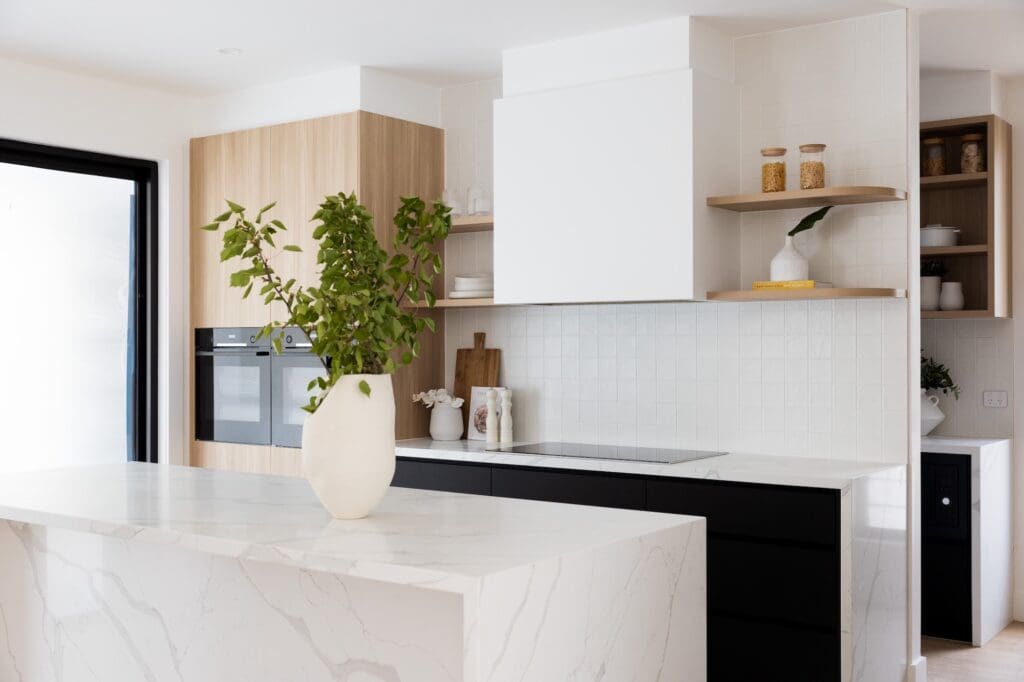 Modern three-toned kitchen in Harrington Grove, featuring a stylish blend of contrasting colours and sleek design elements for a sophisticated, contemporary appearance.