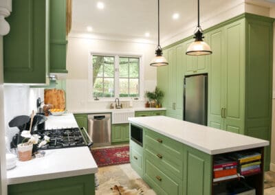 Elegant Southern Highlands kitchen featuring a Smartstone Davinci Blanco island with 40mm stone, fluted glass pendants overhead, and earthy stone veining flowing into Southern Cross Ceramic tiles for a harmonious design.