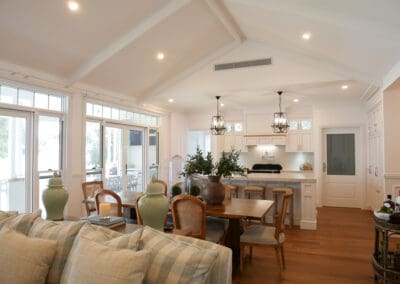 Hand-painted antique oak kitchen cabinetry with flat panel design.