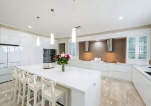 This modern Shark Nose Polyurethane kitchen, finished in Dulux gloss White on White, paired with Quantum Quartz Ultra White 40mm benchtops, demonstrates how an all-white kitchen can be both sleek and timeless.