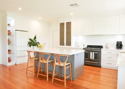 Country-style two-tone Hamptons kitchen in Colo Vale featuring a mix of light and dark cabinetry, rustic accents, and a spacious layout right view