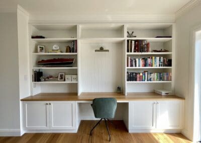 Cozy study nook with custom-built cabinetry by Harrington Kitchens, featuring a functional and stylish design.