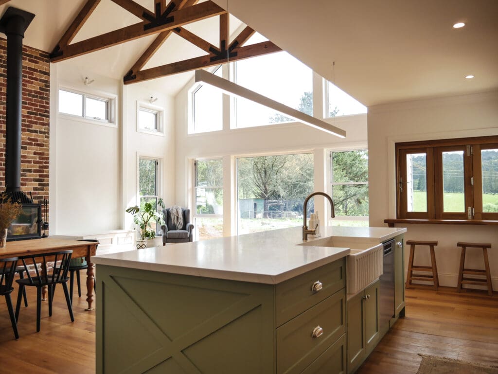 Hamptons-style kitchen on a farm in Robertson's Southern Highlands, featuring natural light from large windows and a charming country-style feel.