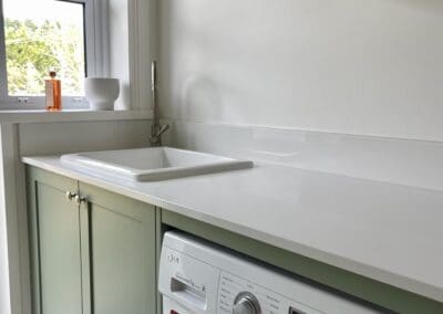 Custom cabinetry in a practical and stylish study painted in Dulux Hogsbristle, with a laundry in Dulux Ramona Green, completing this tasteful renovation.