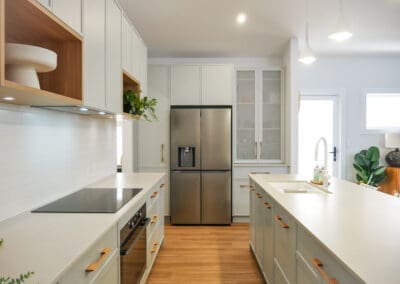 stunning new kitchen in a shaded pale green with kethy oak handles