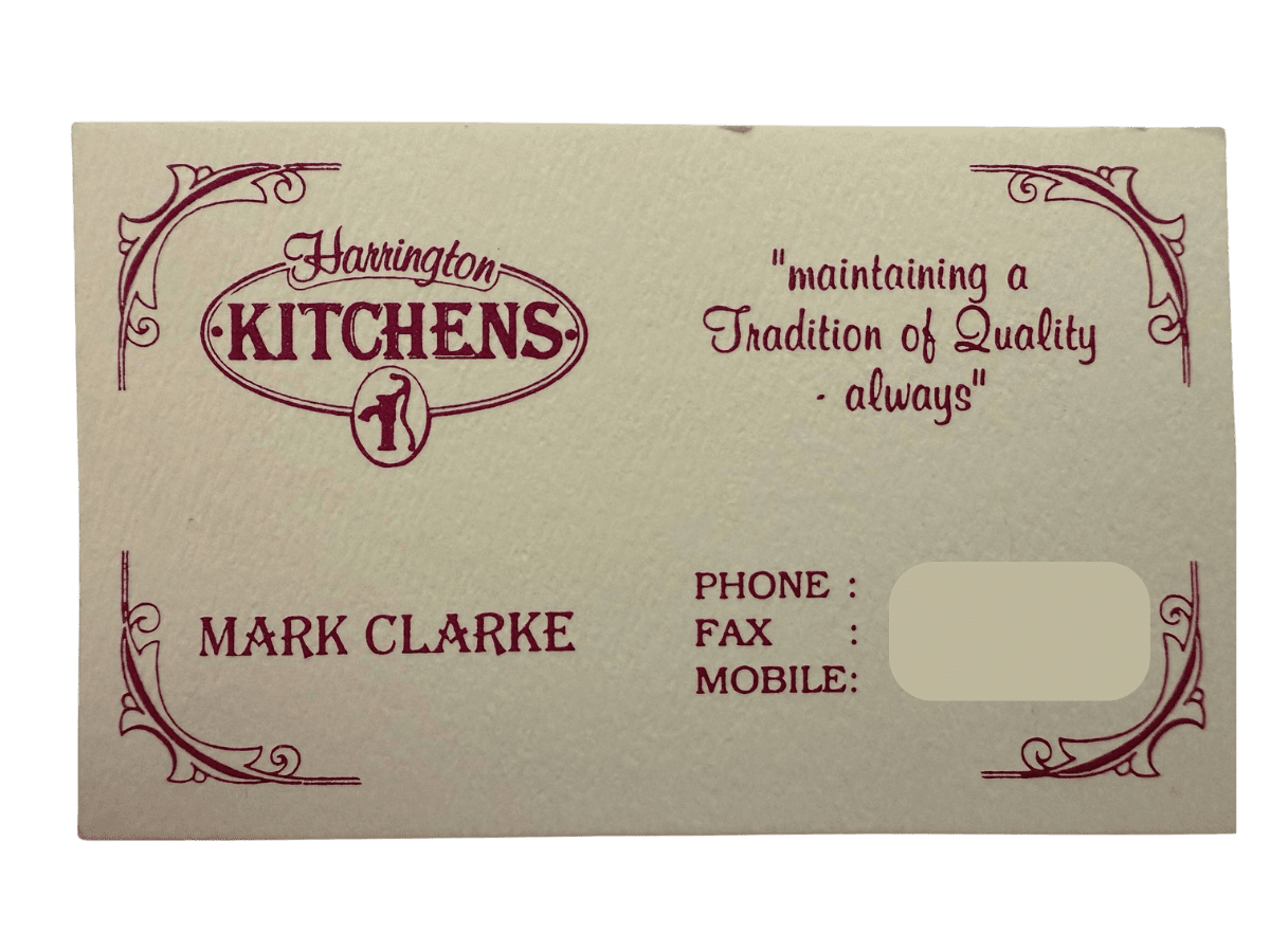 Harrington Kitchens Business Card Harrington Kitchens' original business cards featuring the classic water pump logo, displayed neatly on a surface as a nod to the company’s heritage.