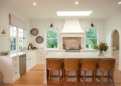 Country kitchen with natural light, custom drawers, and soft neutral palette.