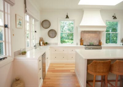 Modern country kitchen with farmhouse-style features and subtle decorative accents.