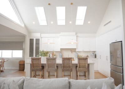 Light-filled contemporary kitchen in a charming Camden residence with an open-plan design and elegant shaker cabinetry.