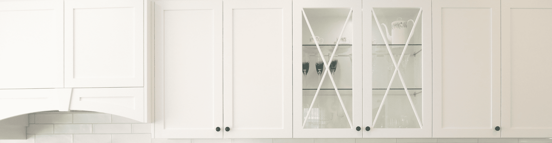 kitchen cabinet banner white kitchen cabinets with cross detail glass cabinets and shaker-style cabinets.