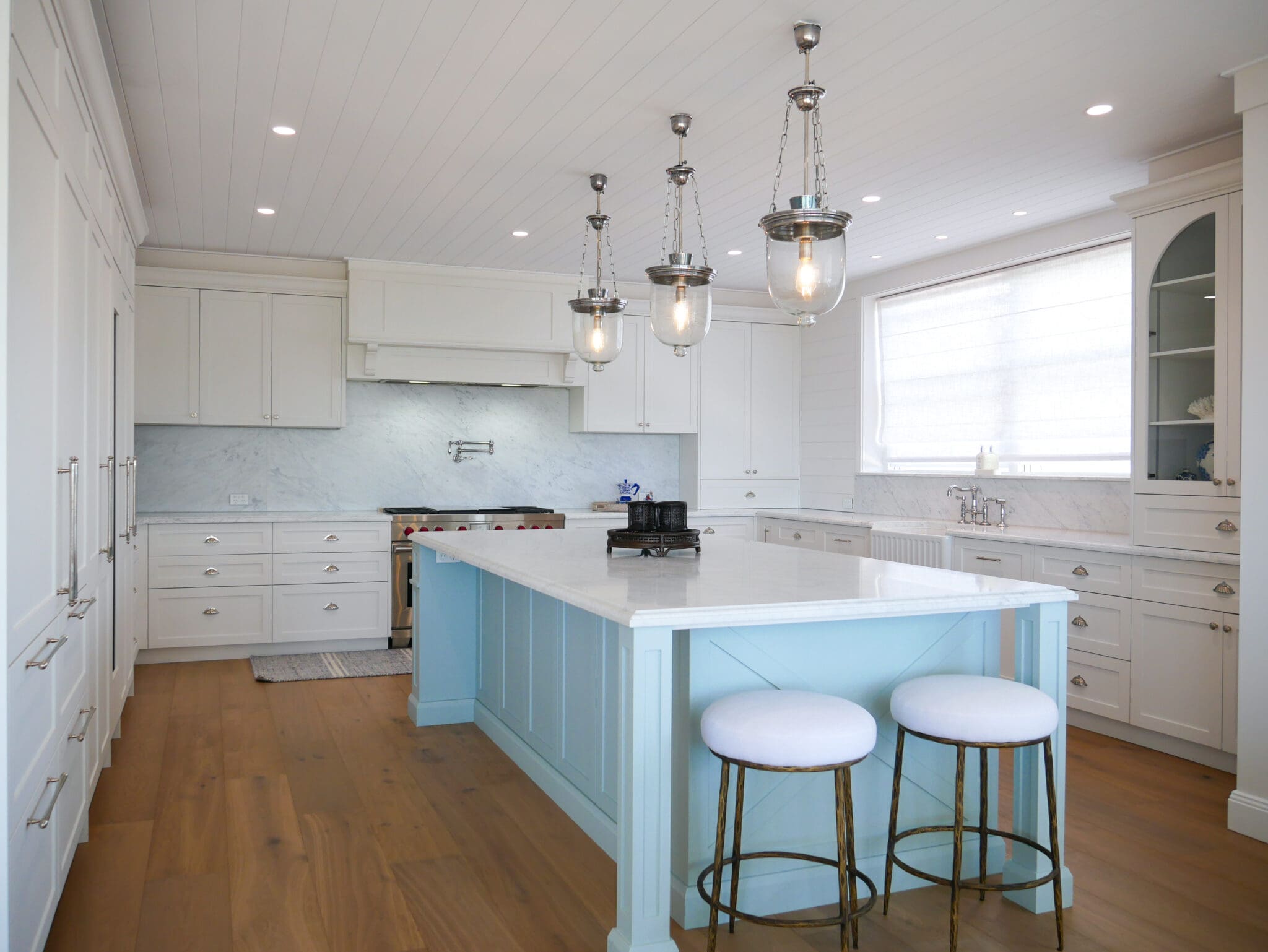Northern Beach Kitchen Collaroy two-toned with blue detailed island and white cabinets in shaker.