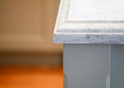 Classic hand-painted kitchen with lambs tongue benchtop edge detail and traditional cabinetry.