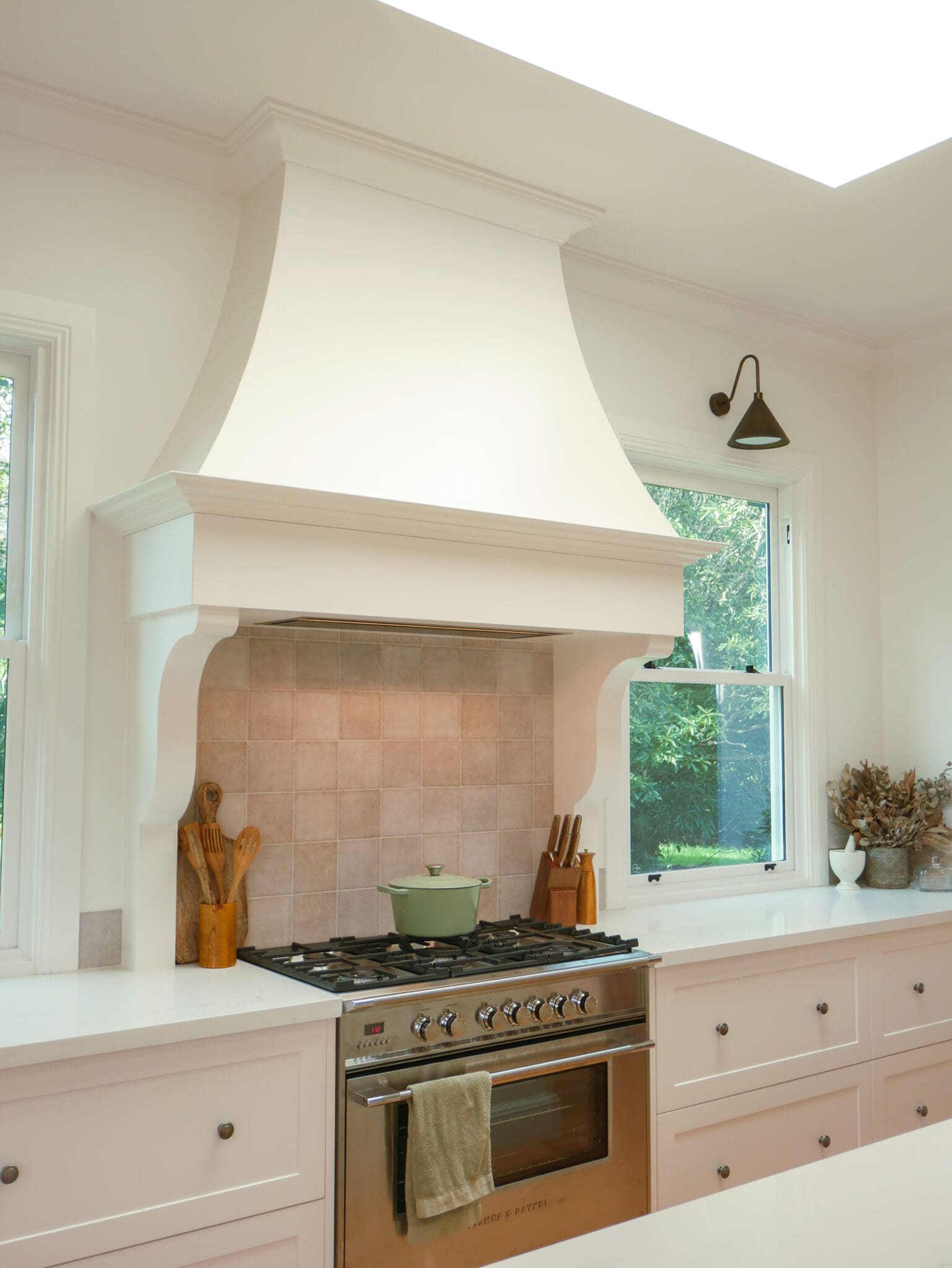 design kitchen featuring custom rangehood focal point.