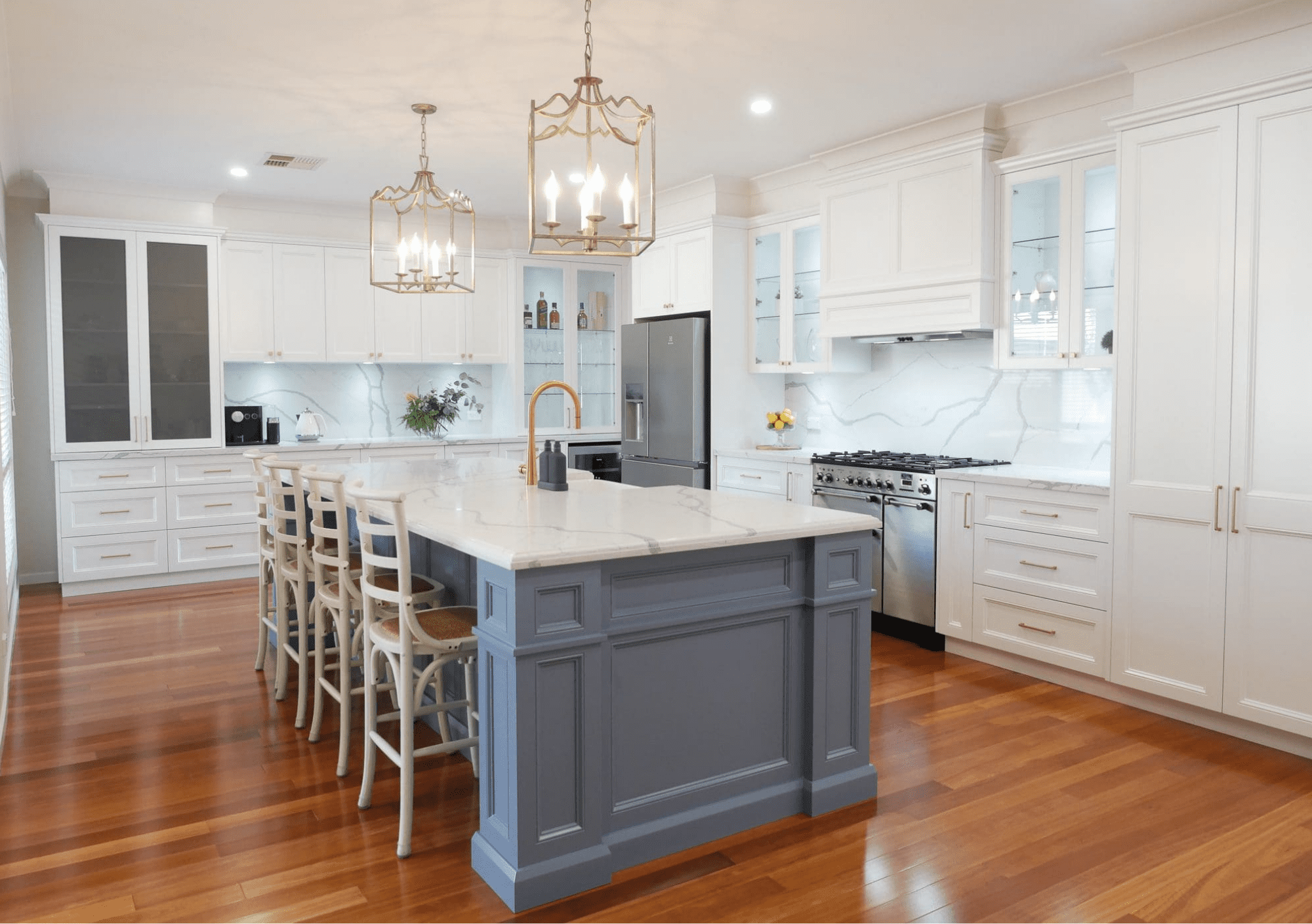 Elegant, Refined Two-Toned Kitchen in Harrington Park, featuring a custom kitchen island, custom rangehood, and custom cabinetry.